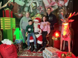 A family in Santa's Grotto at Relaxed Christmas